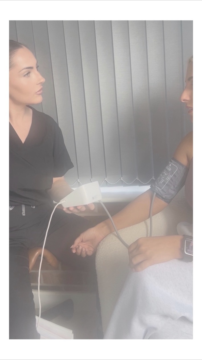 Nicola discussing an assessment with a client at The Functional Care Clinic
